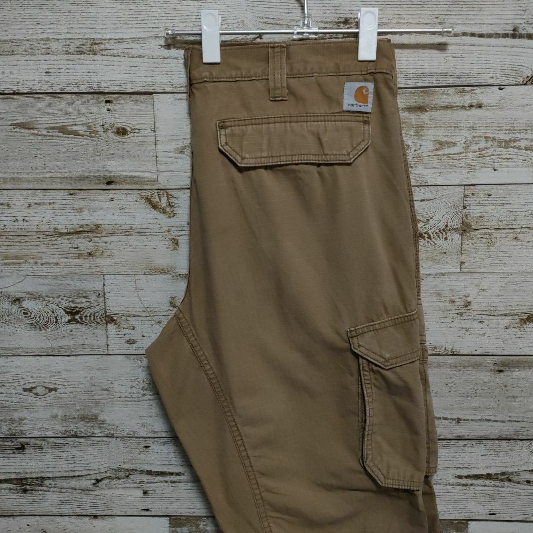 carhartt(カーハート)の【116】USA規格カーハートダック地ワーク系パンツロゴ付き メンズのパンツ(ワークパンツ/カーゴパンツ)の商品写真