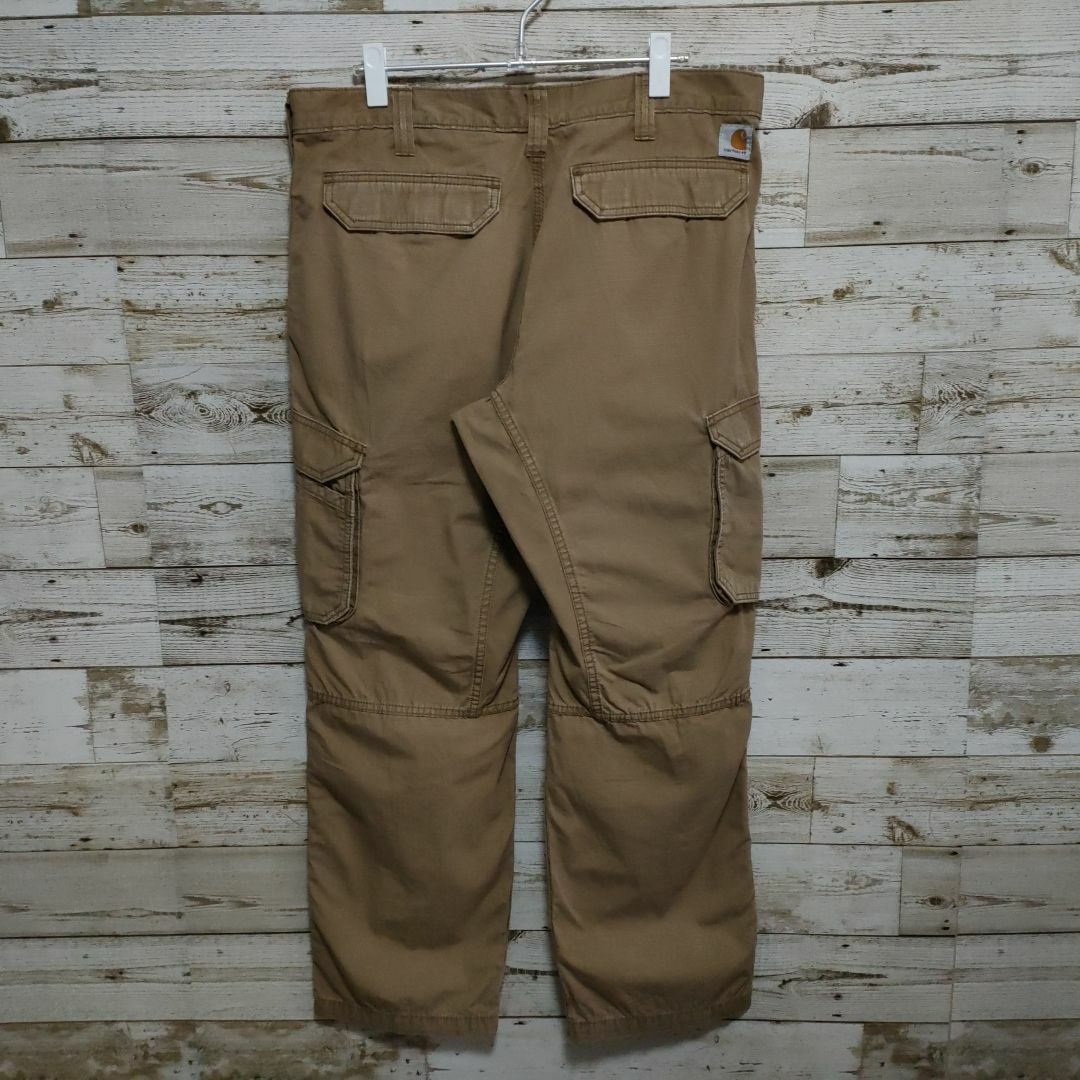 carhartt(カーハート)の【116】USA規格カーハートダック地ワーク系パンツロゴ付き メンズのパンツ(ワークパンツ/カーゴパンツ)の商品写真