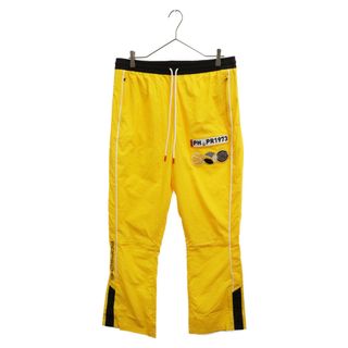 プーマ(PUMA)のPUMA プーマ ×PORSCHE Basketball Woven Pants 626007-01 ポルシェ バスケットボールウーブンパンツ 裾ボタン ナイロンパンツ イエロー(その他)