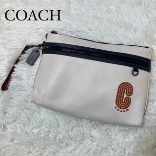 コーチ(COACH)の【良品】コーチ クラッチバッグ アイボリー チャーム ユニセックス(クラッチバッグ)