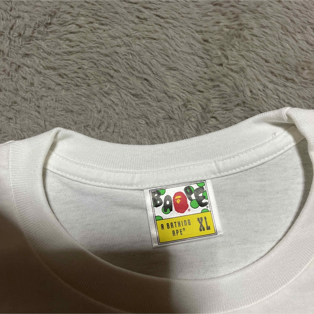 A BATHING APE(アベイシングエイプ)のAPE BAPE KAWS Sakura 桜　SHARK tシャツ　XL メンズのトップス(Tシャツ/カットソー(半袖/袖なし))の商品写真