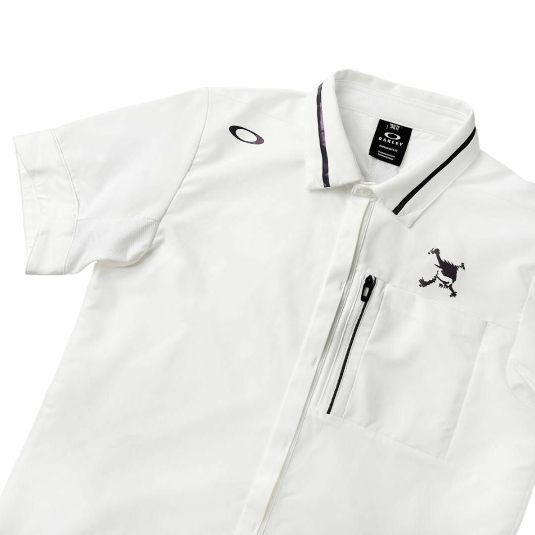 Oakley(オークリー)の美品 オークリー ゴルフ スカル刺繍 ポケット付き 半袖 シャツ メンズ M 白 スポーツ/アウトドアのゴルフ(ウエア)の商品写真