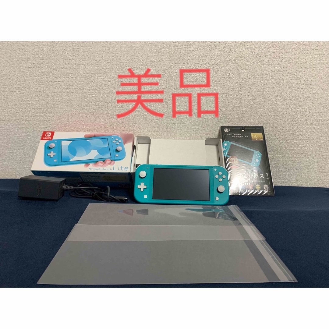 Nintendo Switch(ニンテンドースイッチ)の【美品】Switchライト本体 ターコイズ 強化ガラス保護フィルムのおまけ付き♪ エンタメ/ホビーのゲームソフト/ゲーム機本体(携帯用ゲーム機本体)の商品写真