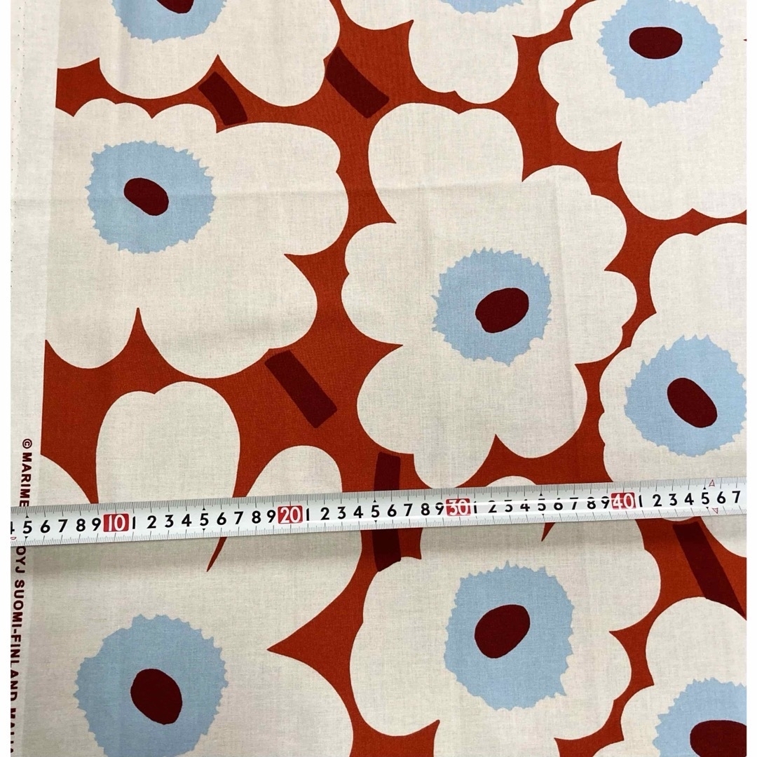 marimekko(マリメッコ)の2022 【ピエニウニッコ】マリメッコ　オレンジ　生地　横70 縦50 ハンドメイドの素材/材料(生地/糸)の商品写真