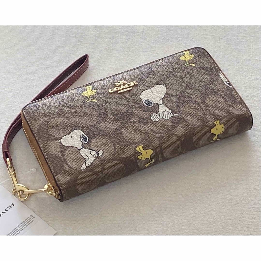 COACH(コーチ)の新品　COACH 長財布　SNOOPY スヌーピー　ウッドストック　シグネチャー レディースのファッション小物(財布)の商品写真