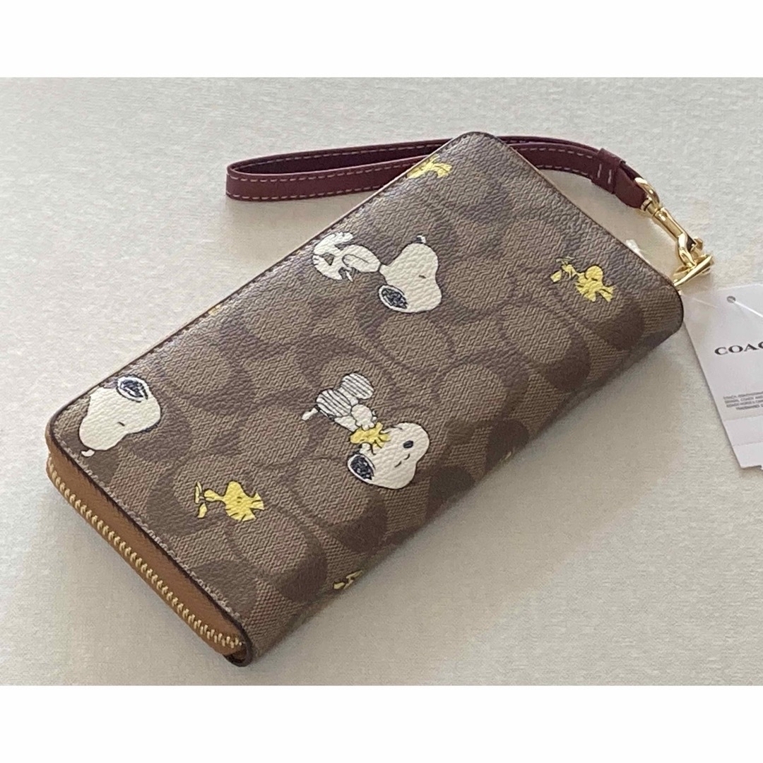 COACH(コーチ)の新品　COACH 長財布　SNOOPY スヌーピー　ウッドストック　シグネチャー レディースのファッション小物(財布)の商品写真