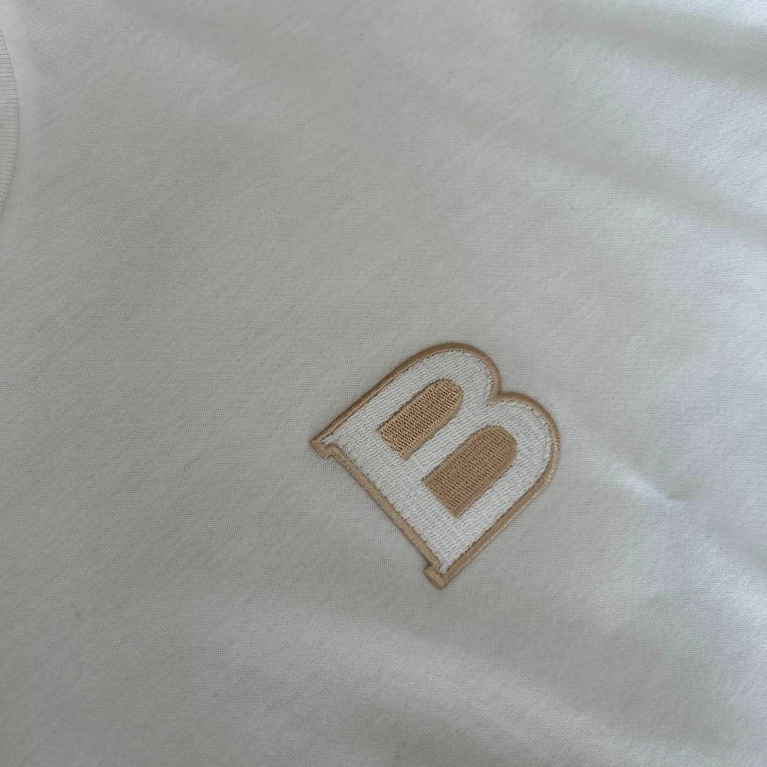 OBLI(オブリ)のOBLI　オブリ　ロゴワッペンTシャツ　F　ホワイトコットン半袖　完売品 レディースのトップス(Tシャツ(半袖/袖なし))の商品写真