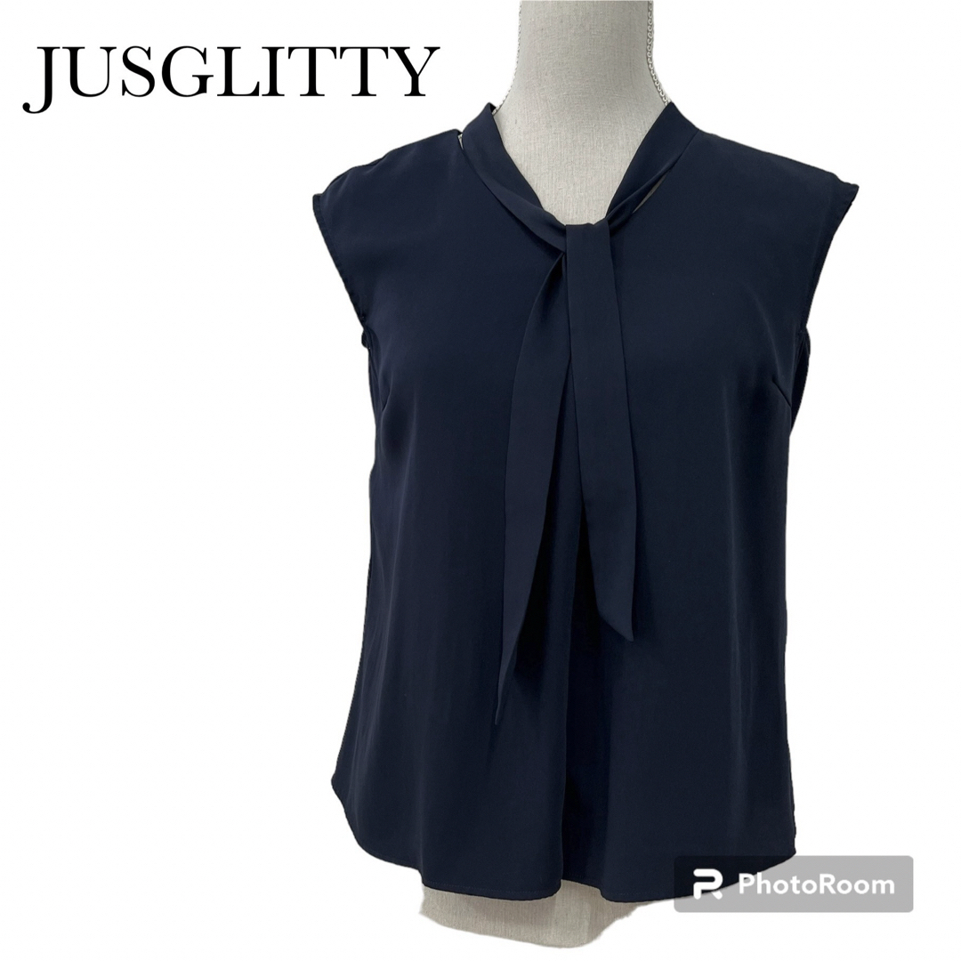 JUSGLITTY(ジャスグリッティー)のジャスグリッティ　ボウタイ付き半袖ブラウス　フレンチスリーブ　ネイビー　サイズ1 レディースのトップス(シャツ/ブラウス(半袖/袖なし))の商品写真