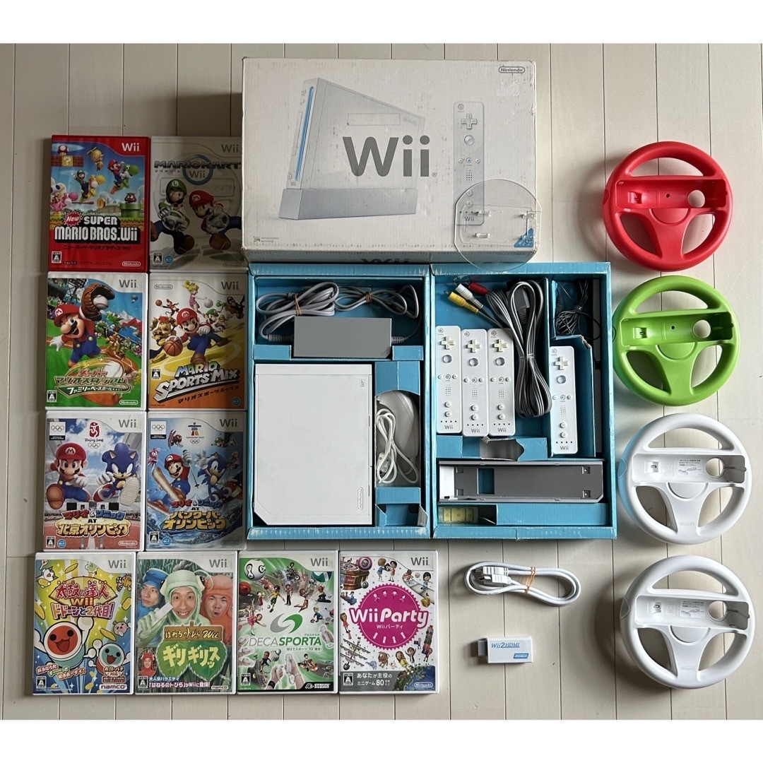 Wii(ウィー)のWii 本体 ハンドル セット マリオカートなどソフト10本おまけあり エンタメ/ホビーのゲームソフト/ゲーム機本体(家庭用ゲーム機本体)の商品写真