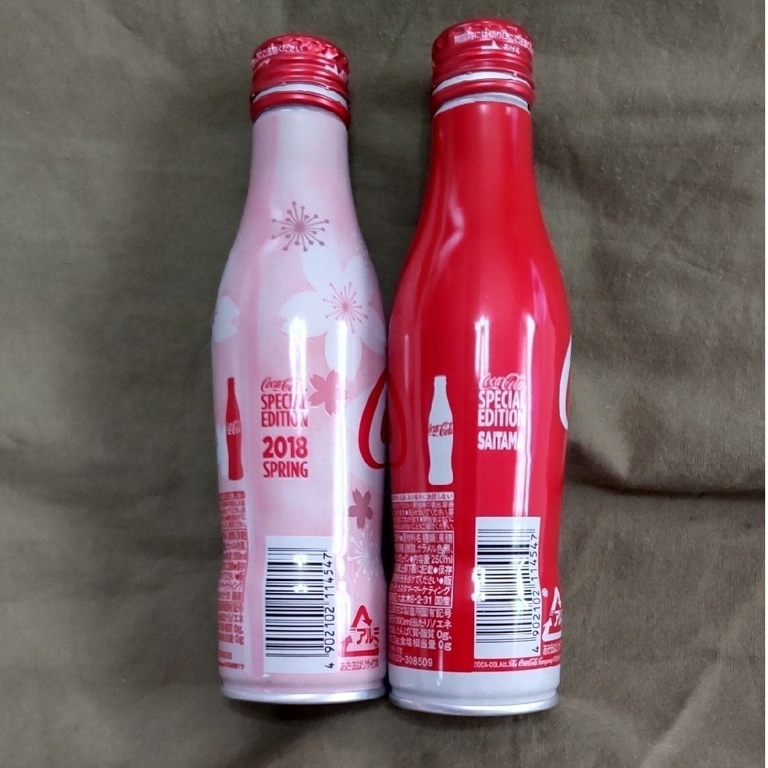 コカ・コーラ(コカコーラ)のコカコーラ　スリムボトル（空缶）　2本セット　SPRINGとSAITAMA エンタメ/ホビーのコレクション(その他)の商品写真