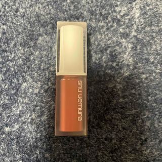 シュウウエムラ(shu uemura)のshu uemura(シュウ ウエムラ) キヌケアグローアップ ももシャーベット(リップグロス)