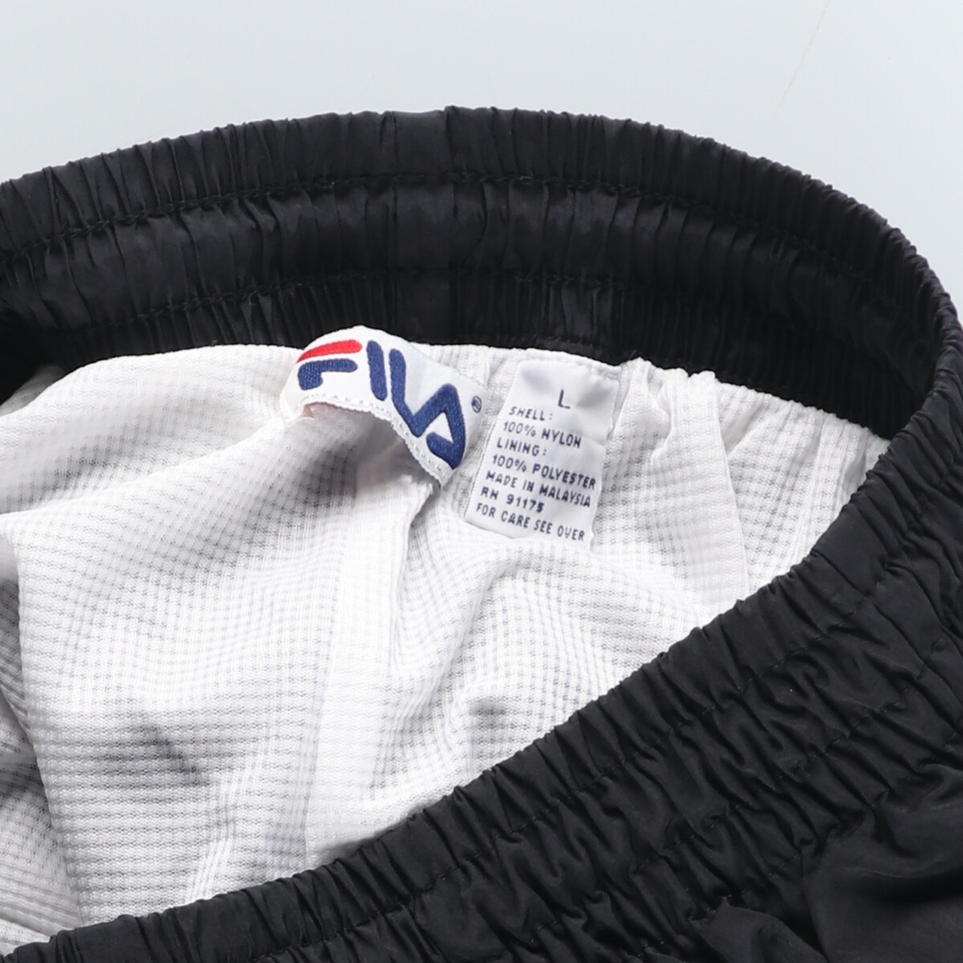 FILA(フィラ)の古着 90年代 フィラ FILA ナイロンパンツ シャカシャカパンツ メンズL ヴィンテージ /eaa431374 メンズのパンツ(その他)の商品写真