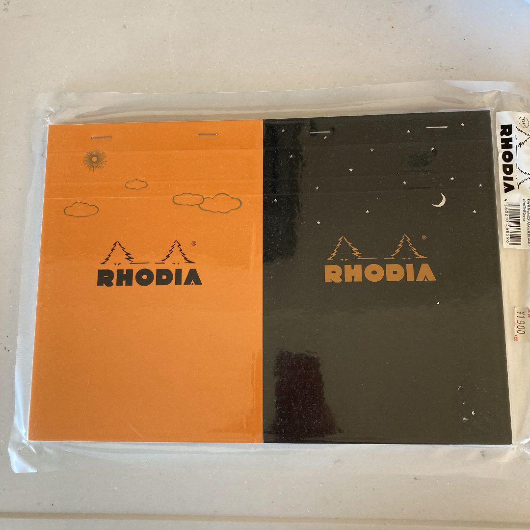 RHODIA(ロディア)のロディア　A5 ブロックメモ　限定セット デイ＆ナイト【オレンジ／ブラック】 インテリア/住まい/日用品の文房具(ノート/メモ帳/ふせん)の商品写真