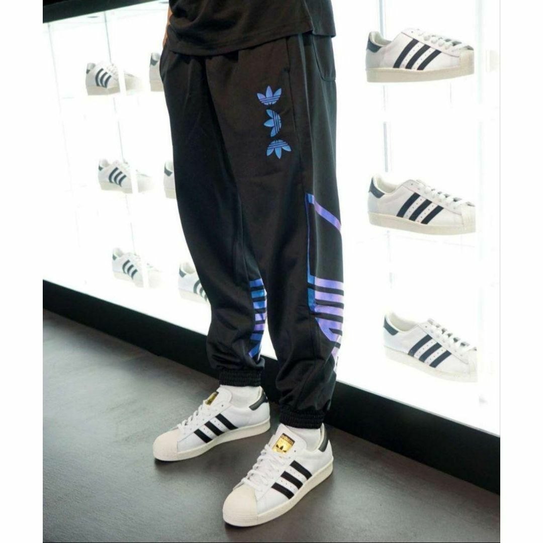 Originals（adidas）(オリジナルス)のアディダス メタリックブルー ZENOトラックパンツ ジャージ 男性S デカロゴ メンズのパンツ(その他)の商品写真