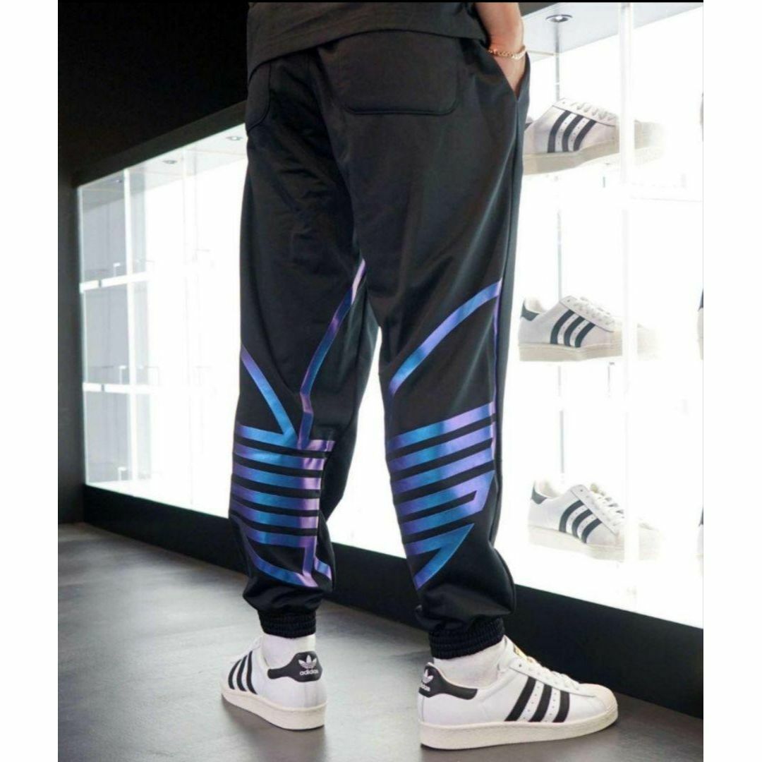 Originals（adidas）(オリジナルス)のアディダス メタリックブルー ZENOトラックパンツ ジャージ 男性S デカロゴ メンズのパンツ(その他)の商品写真