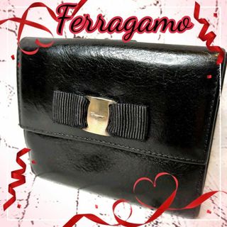 サルヴァトーレフェラガモ(Salvatore Ferragamo)の【美品】サルヴァトーレフェラガモ 二つ折り財布 バラリボン ゴールドロゴ 黒(財布)