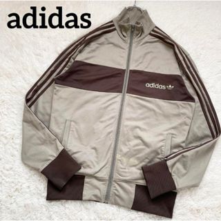 アディダス(adidas)の【激レア】アディダス ヴィンテージ トラックジャケット 万国旗 黒タグ 茶 L(ジャージ)