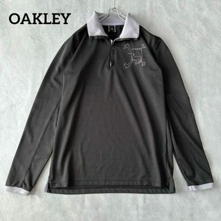 オークリー(Oakley)のOAKLEY スカルコレクション デカロゴ ハーフジップ  Mサイズゴルフウェア(ポロシャツ)