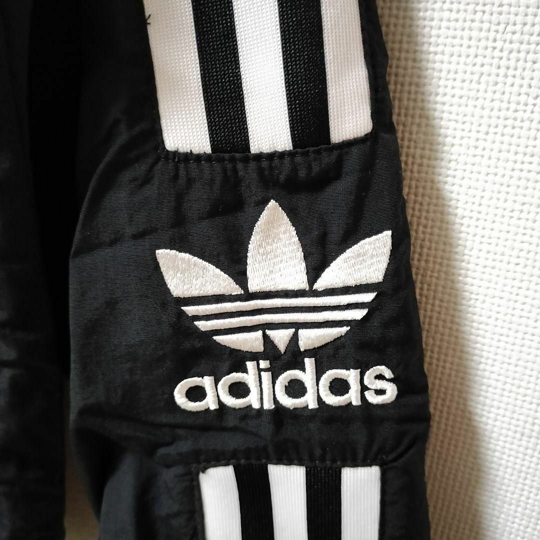 Originals（adidas）(オリジナルス)のアディダス 黒 ロックアップ ウーブントラックジャケット ジャージ 女性 L レディースのジャケット/アウター(ブルゾン)の商品写真