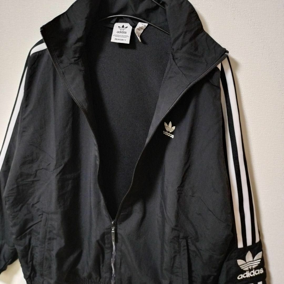 Originals（adidas）(オリジナルス)のアディダス 黒 ロックアップ ウーブントラックジャケット ジャージ 女性 L レディースのジャケット/アウター(ブルゾン)の商品写真