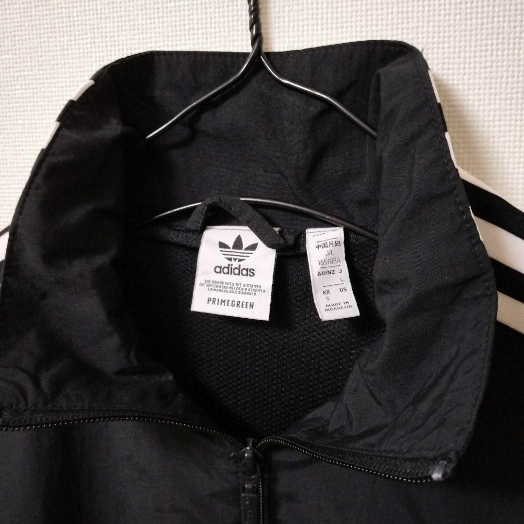 Originals（adidas）(オリジナルス)のアディダス 黒 ロックアップ ウーブントラックジャケット ジャージ 女性 L レディースのジャケット/アウター(ブルゾン)の商品写真