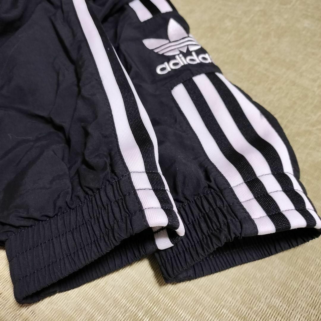 Originals（adidas）(オリジナルス)のアディダス 黒 ロックアップ ウーブントラックジャケット ジャージ 女性 L レディースのジャケット/アウター(ブルゾン)の商品写真