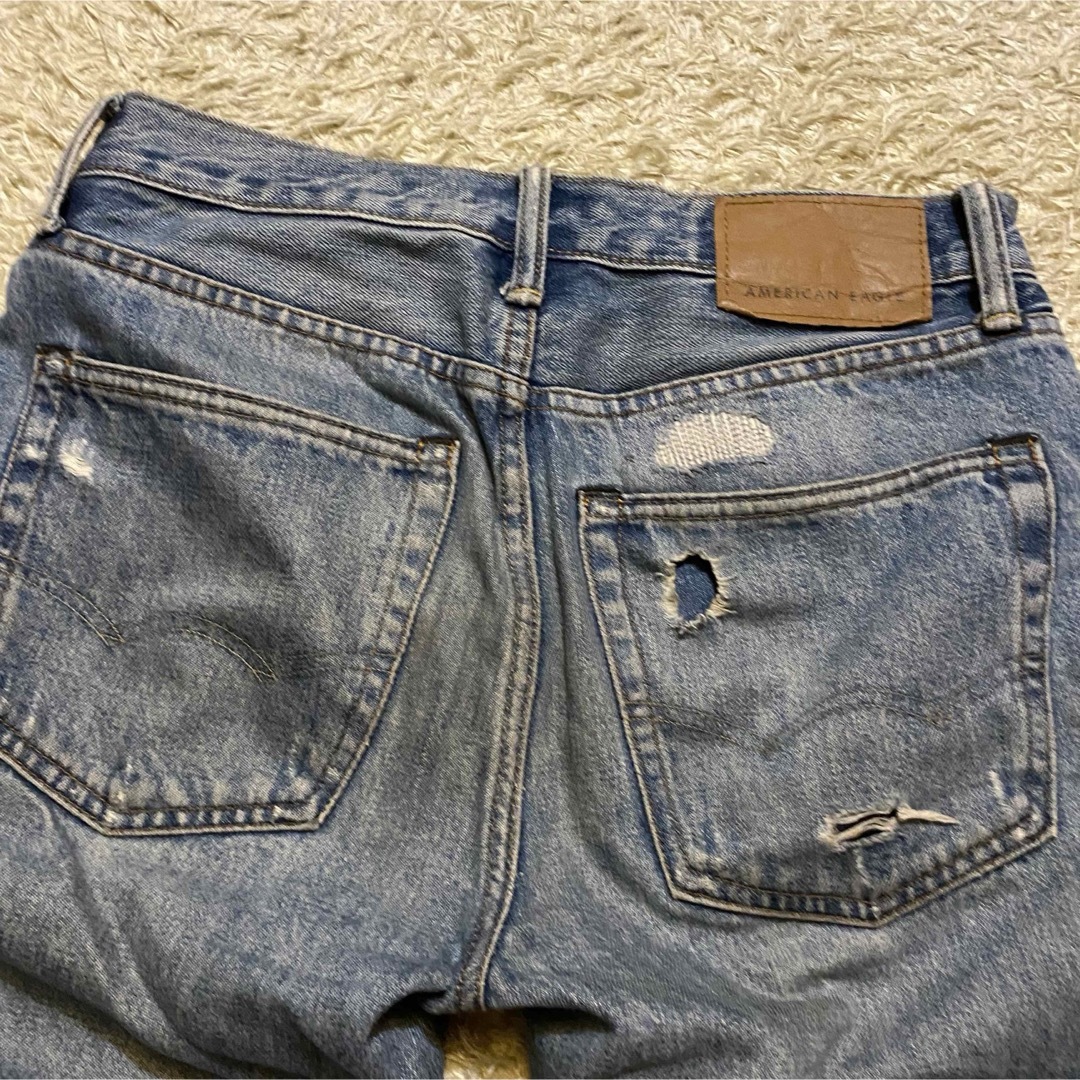 American Eagle(アメリカンイーグル)のAMERICAN EAGLE × keith haring ダメージ　デニム　M レディースのパンツ(デニム/ジーンズ)の商品写真