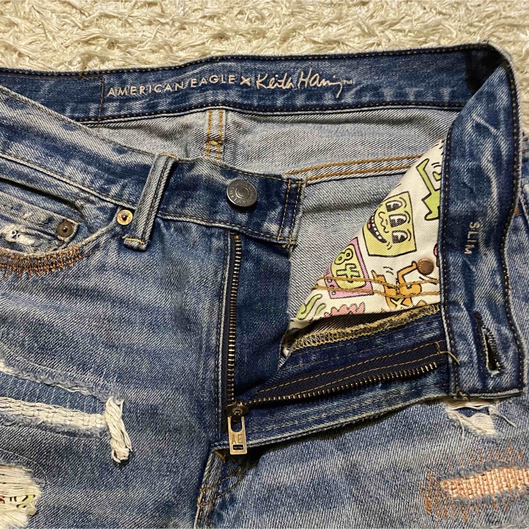 American Eagle(アメリカンイーグル)のAMERICAN EAGLE × keith haring ダメージ　デニム　M レディースのパンツ(デニム/ジーンズ)の商品写真