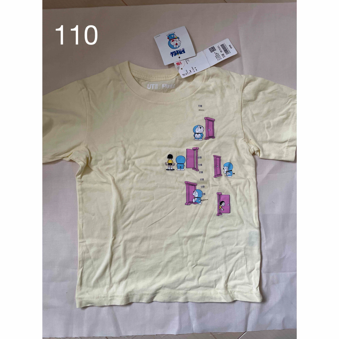 UNIQLO(ユニクロ)のTシャツ　ドラえもん　黄色 キッズ/ベビー/マタニティのキッズ服女の子用(90cm~)(Tシャツ/カットソー)の商品写真