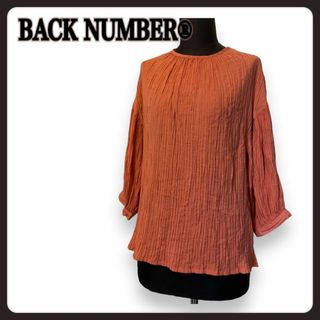 バックナンバー(BACK NUMBER)のBACK NUMBER 七分ボリューム袖ブラウス オレンジ系 ゆったり伸縮 美品(シャツ/ブラウス(長袖/七分))