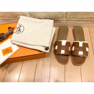 エルメス(Hermes)のエルメス　オラン　ゴールド　38 (サンダル)