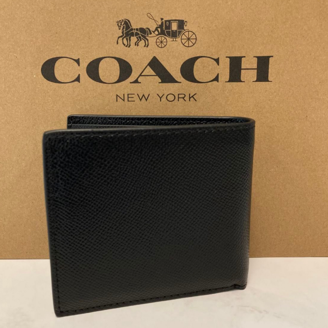 COACH(コーチ)の新品　コーチ　ブラック　Cチャーム　メンズ　折り財布　小銭入れ有 レディースのファッション小物(財布)の商品写真