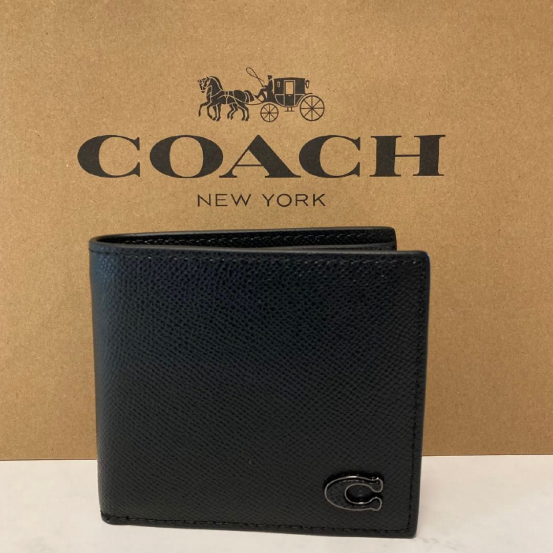 COACH(コーチ)の新品　コーチ　ブラック　Cチャーム　メンズ　折り財布　小銭入れ有 レディースのファッション小物(財布)の商品写真