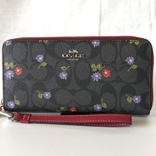 コーチ(COACH)の新品未使用コーチ花柄×シグネチャーストラップ付きラウンドファスナー(財布)