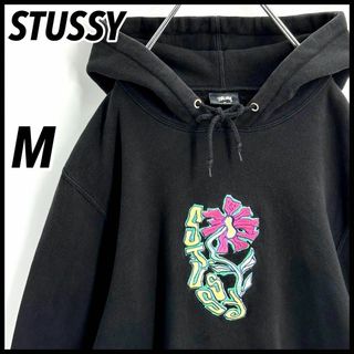 ステューシー(STUSSY)の【希少デザイン】ステューシー　センター刺繍ロゴ　花柄　パーカー　入手困難　M　黒(パーカー)