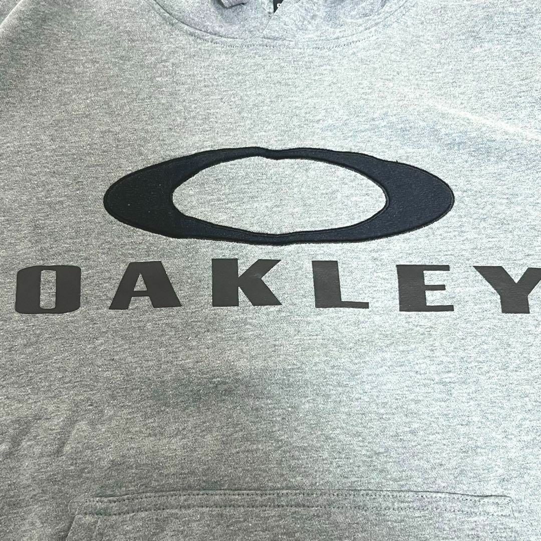 Oakley(オークリー)のレア古着 プルオーバー スカルライン グレー メンズL プリントロゴ スウェット メンズのトップス(スウェット)の商品写真