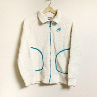 NIKE - NIKE(ナイキ) ブルゾン サイズM レディース - アイボリー×ブルー 長袖/秋/冬 ポリエステル