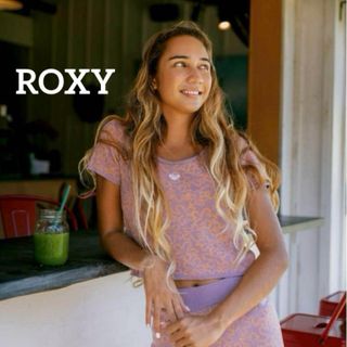 ロキシー(Roxy)のROXY ニット 半袖 トップス 丈短め 花柄 ラベンダー TシャツMサイズ 紫(カットソー(半袖/袖なし))