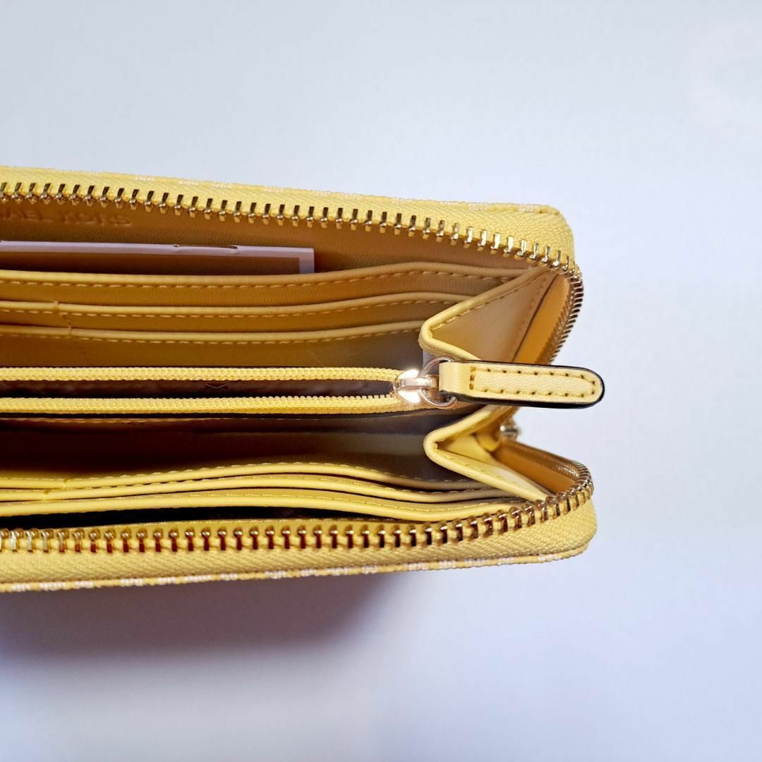 Michael Kors(マイケルコース)のMICHAEL KORS レディース 長財布 ロゴ イエロー 黄色 シグネチャー レディースのファッション小物(財布)の商品写真