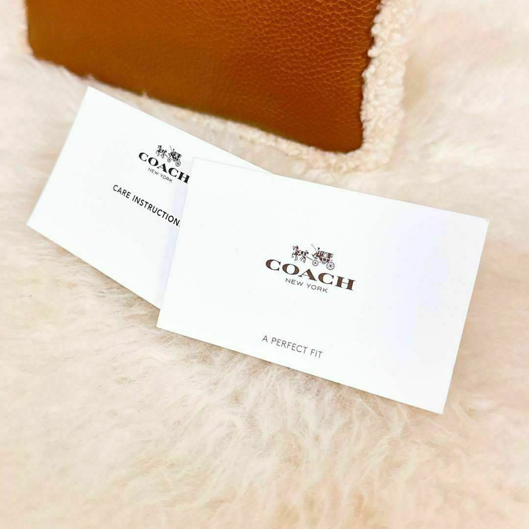 COACH(コーチ)の【コーチ】COACH 型押し レザー 革 ファー ドッキング ポーチ 茶×白 レディースのファッション小物(ポーチ)の商品写真