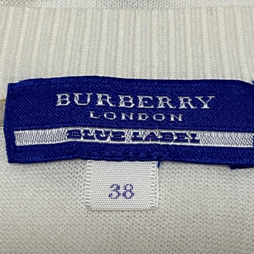 BURBERRY BLUE LABEL(バーバリーブルーレーベル)のBurberry Blue Label(バーバリーブルーレーベル) カーディガン サイズ38 M レディース - 白×ベージュ×イエロー 七分袖/チェック柄/フリル レディースのトップス(カーディガン)の商品写真