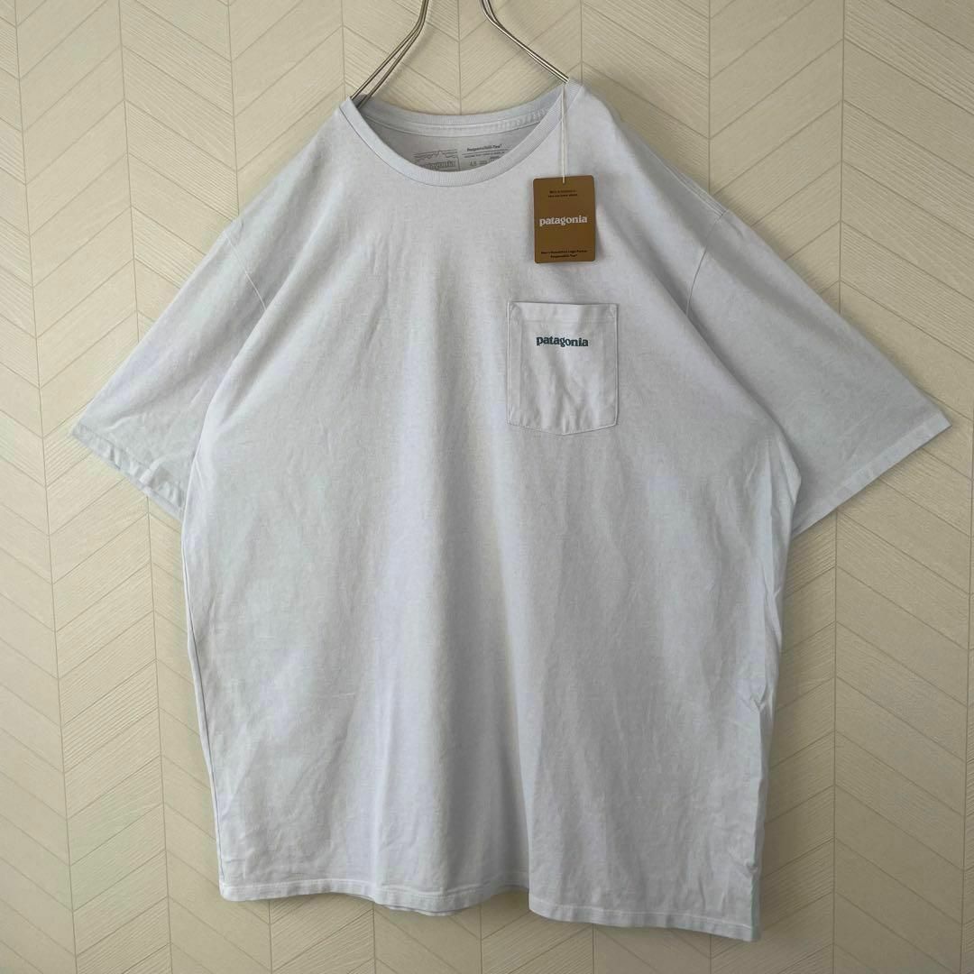 patagonia(パタゴニア)の激レア 新品 Patagonia パタゴニア Tシャツ 波 ポケT 白 XL半袖 メンズのトップス(Tシャツ/カットソー(半袖/袖なし))の商品写真