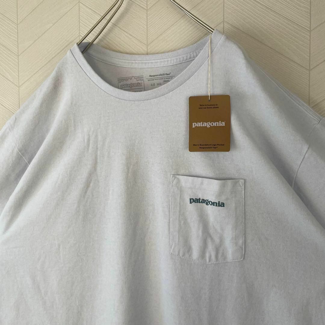 patagonia(パタゴニア)の激レア 新品 Patagonia パタゴニア Tシャツ 波 ポケT 白 XL半袖 メンズのトップス(Tシャツ/カットソー(半袖/袖なし))の商品写真