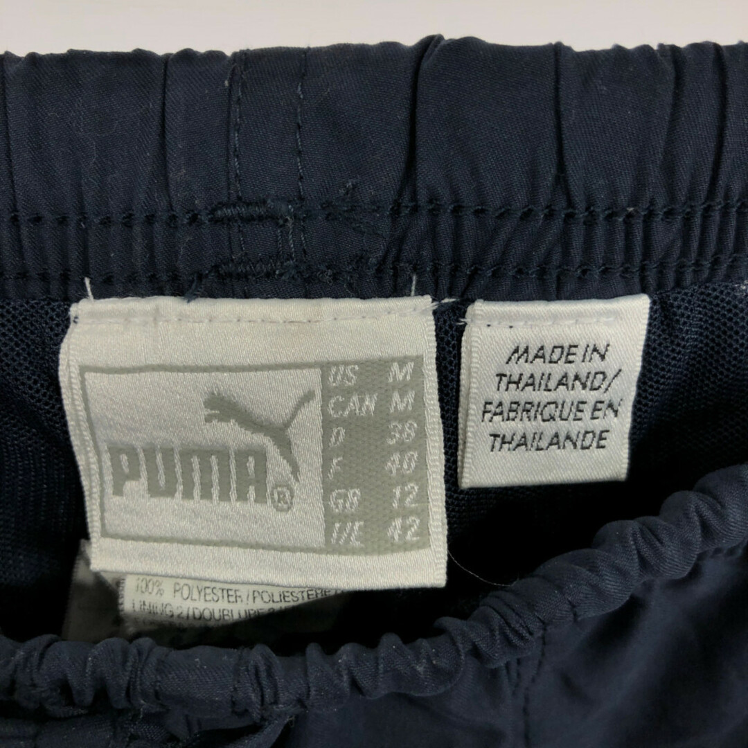 PUMA(プーマ)の90年代 PUMA プーマ ジャージ トラックパンツ スポーツ ワンポイントロゴ ネイビー (メンズ M) 中古 古着 Q3086 メンズのパンツ(その他)の商品写真