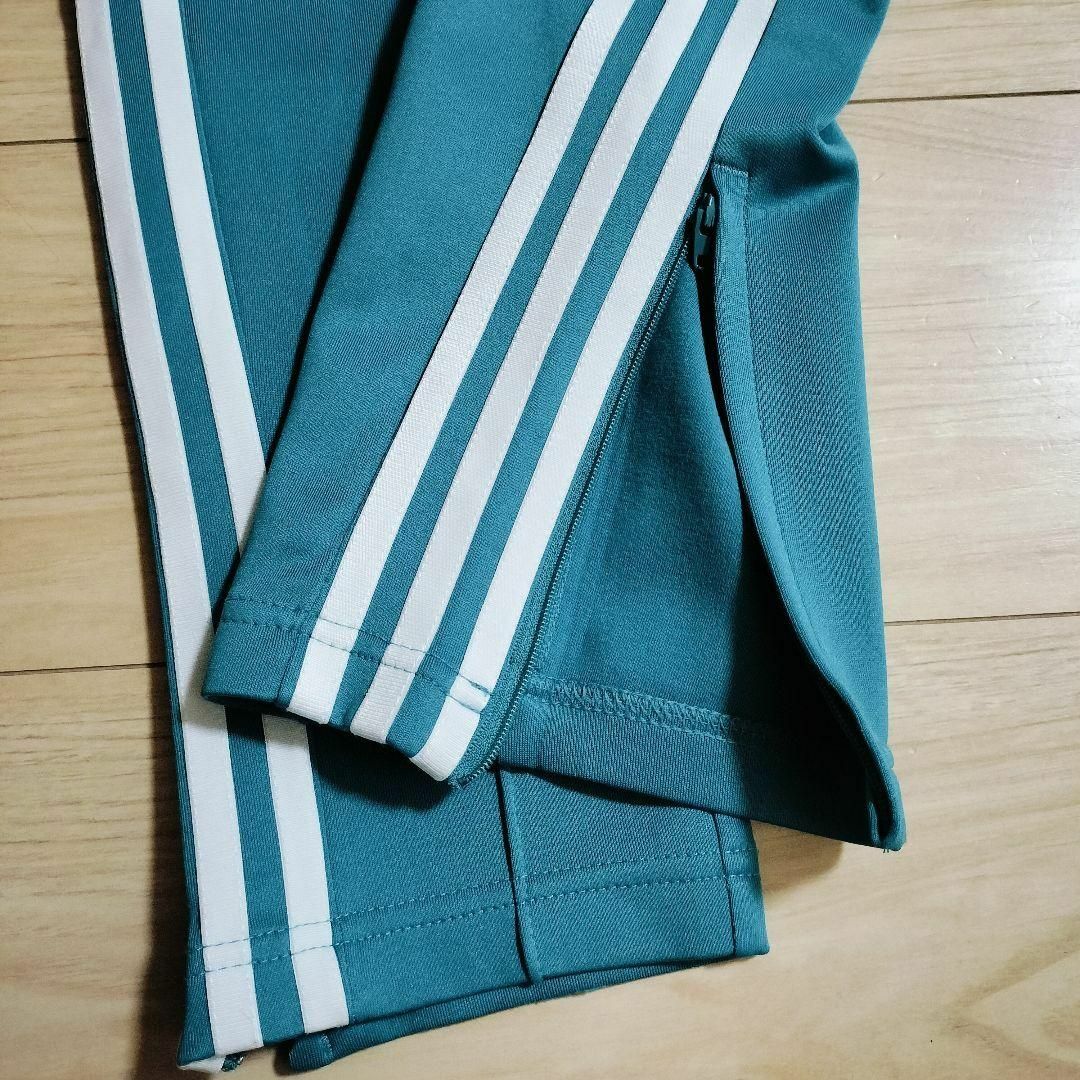 Originals（adidas）(オリジナルス)のアディダス 青緑 スーパースター トラックパンツ ジャージ 女性 スリムパンツ レディースのパンツ(その他)の商品写真