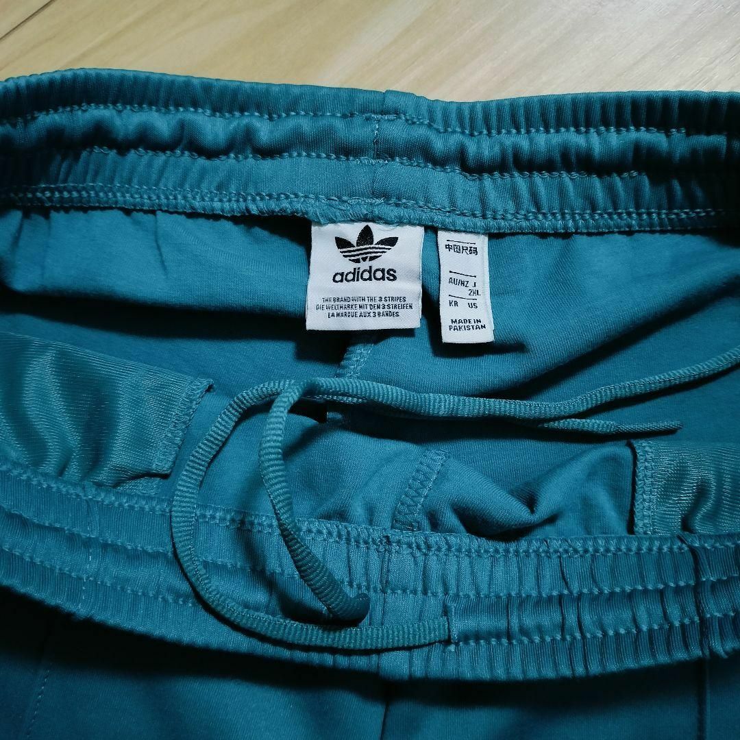 Originals（adidas）(オリジナルス)のアディダス 青緑 スーパースター トラックパンツ ジャージ 女性 スリムパンツ レディースのパンツ(その他)の商品写真