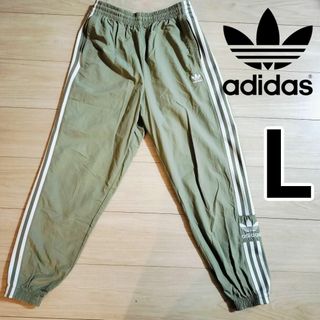 オリジナルス(Originals（adidas）)のadidas カーキ ロックアップ ウーブンパンツ ジャージ シャカパン 女性L(その他)