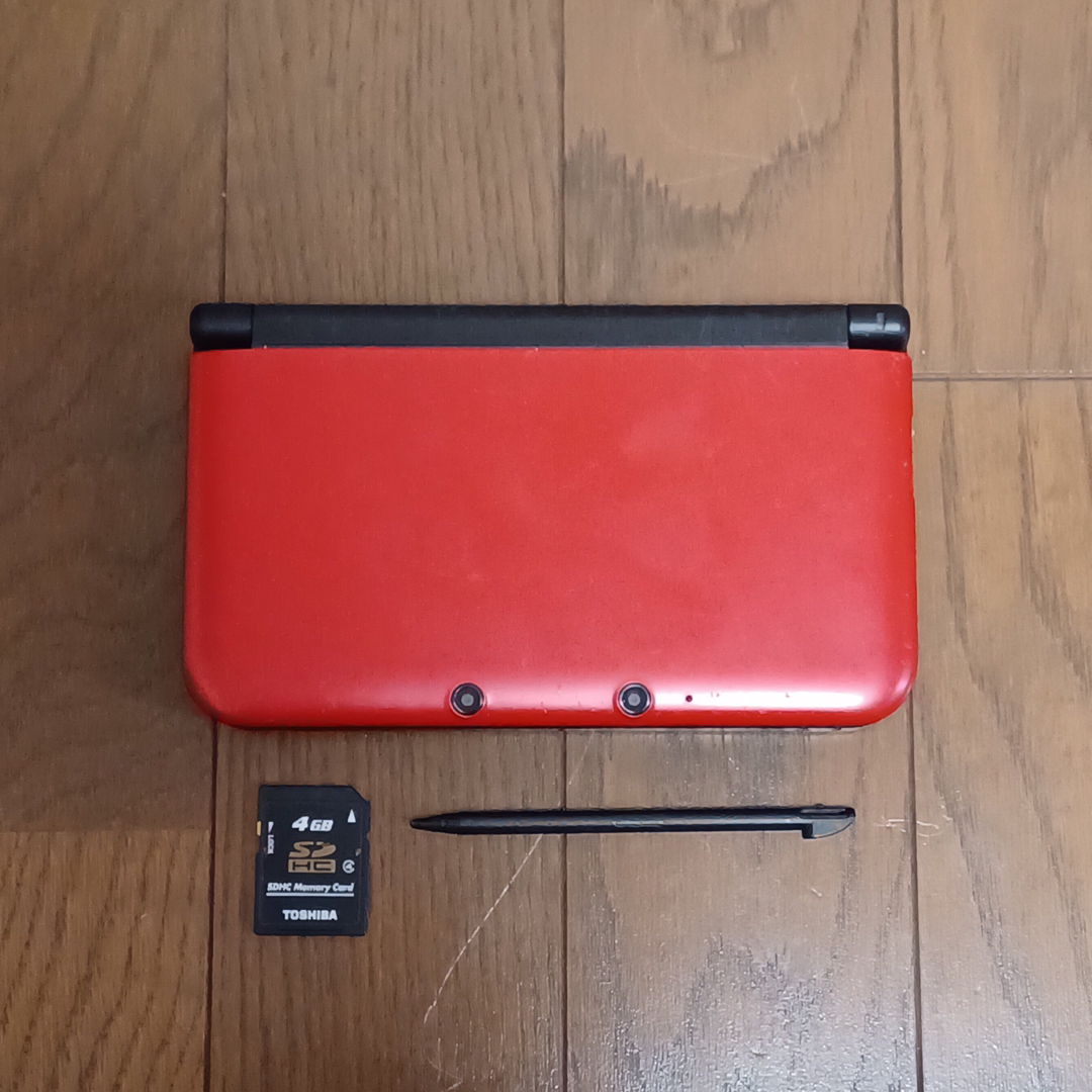 ニンテンドー3DS(ニンテンドー3DS)のニンテンドー3DS LL レッド×ブラック 中古 エンタメ/ホビーのゲームソフト/ゲーム機本体(携帯用ゲーム機本体)の商品写真