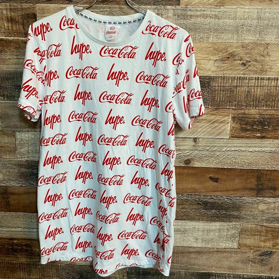 コカ・コーラ(コカコーラ)のHYPE Coca Cola 総柄　Tシャツ レディースL メンズM レディースのトップス(Tシャツ(半袖/袖なし))の商品写真