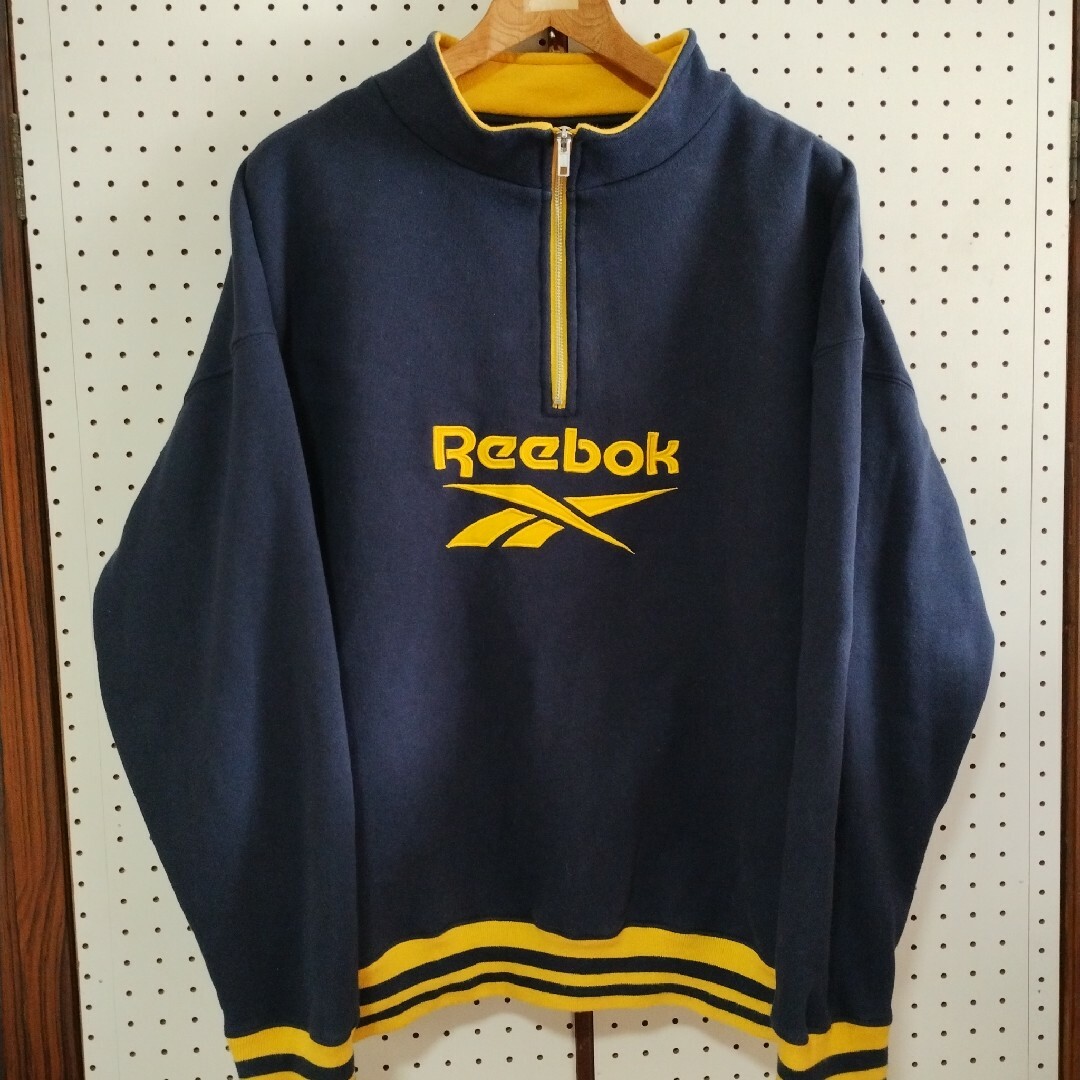 Reebok(リーボック)のReebok　リーボック　ハーフジップ　トレーナー　XL　古着　青✕黄　デカロゴ メンズのトップス(スウェット)の商品写真